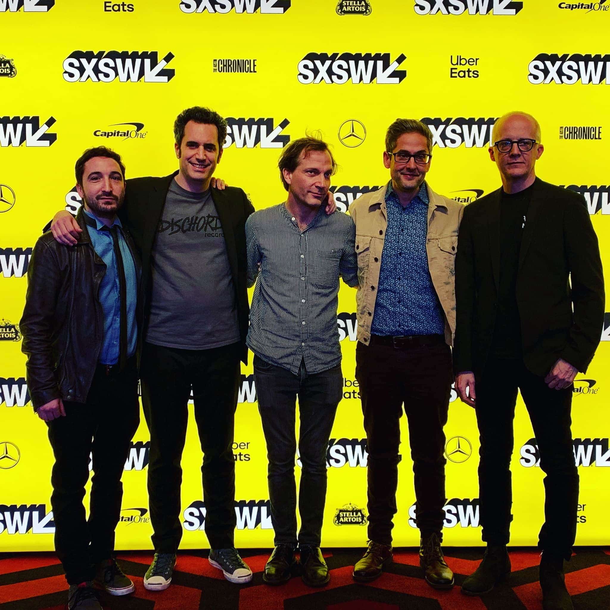 L – R SX photo: Ian Jacobs (Producer/Editor), Eric Mahoney (Director/Producer), John Schmersal (Brainiac, Guitar), Tyler Trent (Brainiac, Drums), Juan Monasterio (Brainiac, Bass)